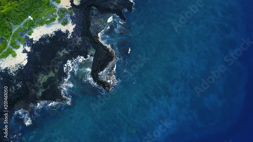 Top aerial view to the blue lagoon on the beach of Hawaiian coastline. USA