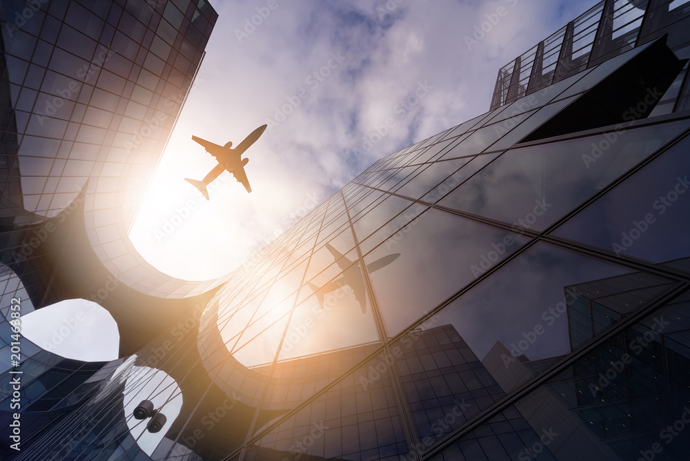 plane over highrise buildings plane over highrise buildings