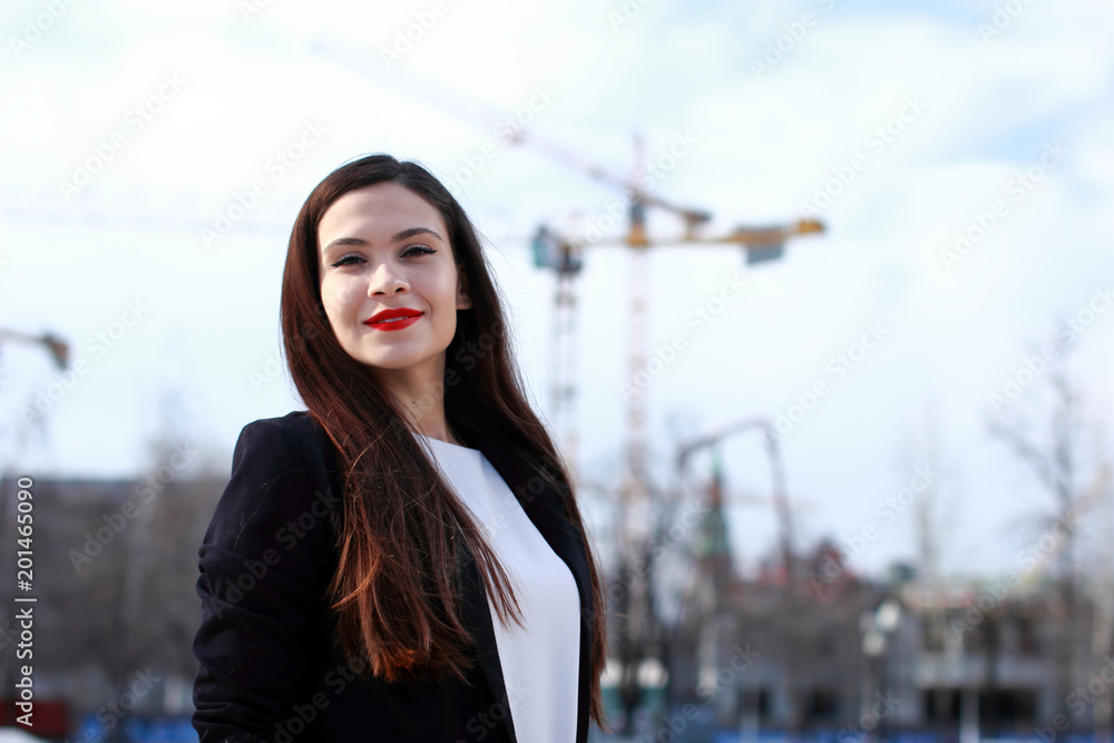 Portrait of young smiling successful business woman. People, cute, outdoor. Happy emotional beautiful girl laughing at the camera. Portrait of young smiling successful business woman. People, cute, outdoor. Happy emotional beautiful girl laughing at the camera.