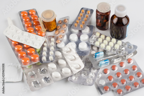 Medicine. Science. Multicolored tablets in different packages lying on the table