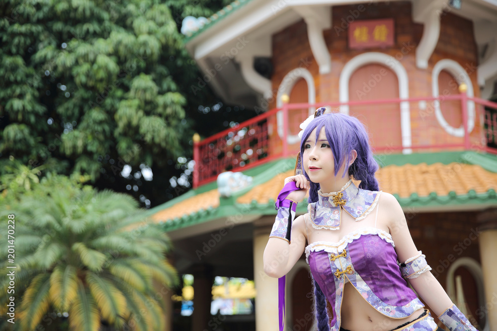 Portrait of asian young woman with purple Chinese dress cosplay with temple Portrait of asian young woman with purple Chinese dress cosplay with temple