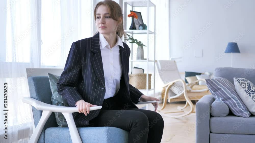 Young Woman Coming To Room and Sitting on Sofa Young Woman Coming To Room and Sitting on Sofa
