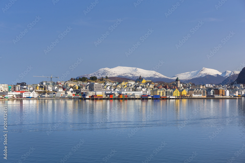Naklejka premium Architecture of Alesund town reflected in the water, Norway