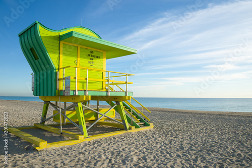 Scenic morning view of an iconic lifeguard tower in bright pastel colors on South Beach, Miami