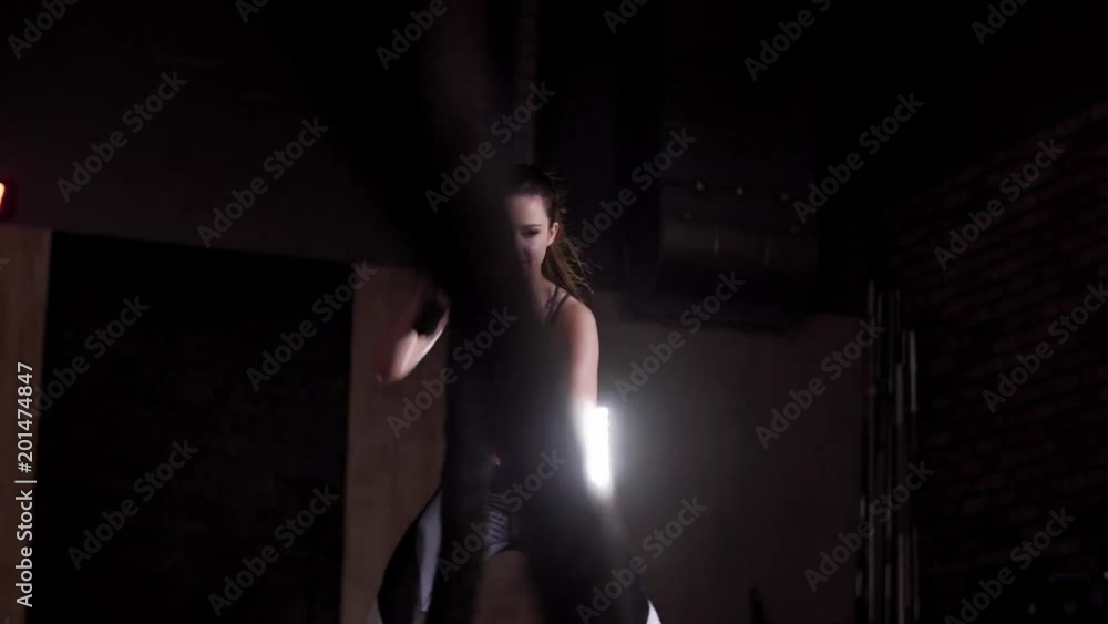 Woman training with ropes