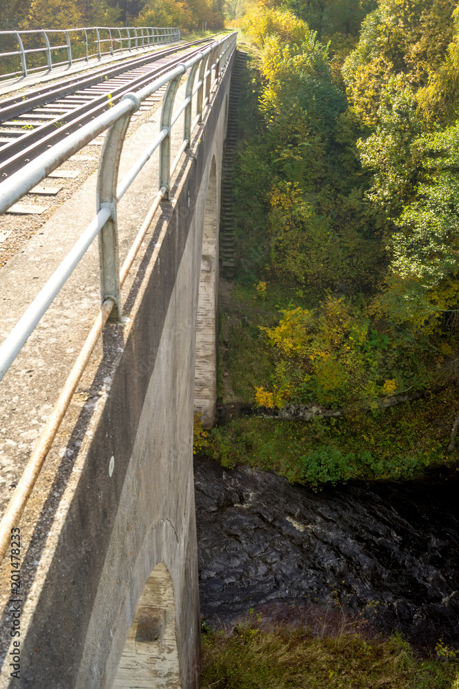 Obraz premium View down from the railway bridge near the village of Tokarivka, Kaliningrad region.