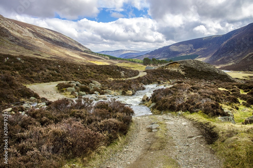 Scottish landscape and brook in Cairngorm Mountains. Way from Invermark to Mount Keen. Angus, Aberdeenshire, Scotland, United Kingdom.