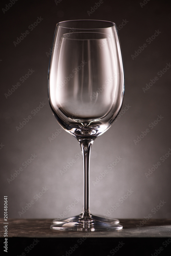 two empty wineglasses in row on black two empty wineglasses in row on black
