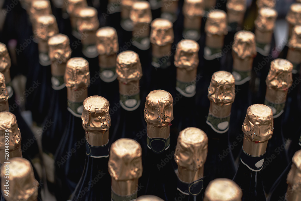 Bottles of celebratory champagne in the store. Many bottles in the wine store.
