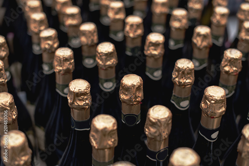 Obraz na płótnie Bottles of celebratory champagne in the store. Many bottles in the wine store. w salonie