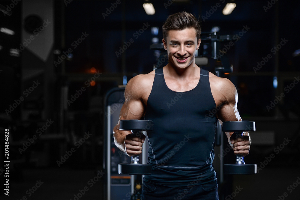 Handsome model young man workout in gym Handsome model young man workout in gym