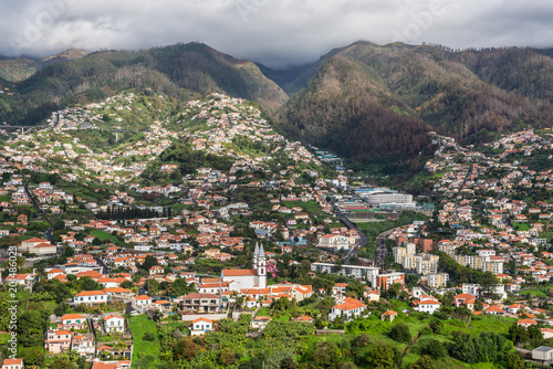 View of the Funchal city on the slope of the mountain in the harbour at Seaport of Madeira Island, Portugal