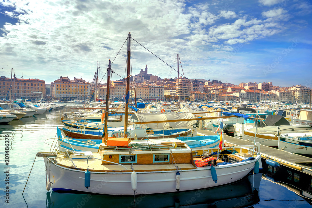 Town view and harbour with boats in old port of Marseilles. France