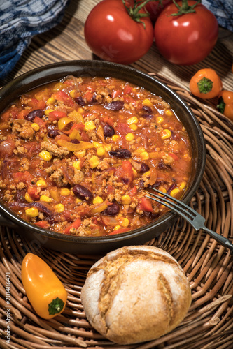 Chili con carne in a clay pan.