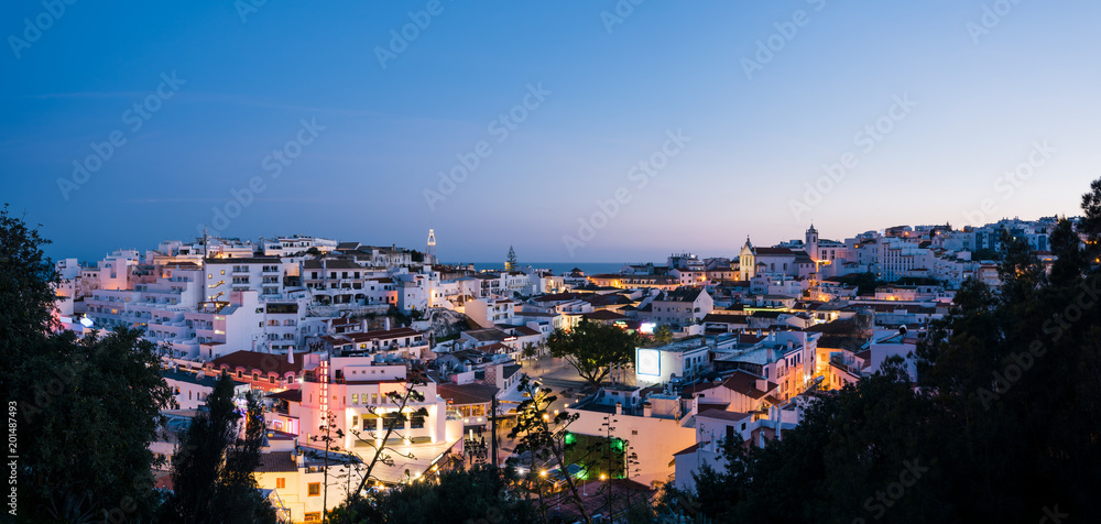 Panoramic, night view of the Old Town of Albufeira City in Algarve, Portugal. Albufeira is a coastal city in the southern Algarve region of Portugal. 