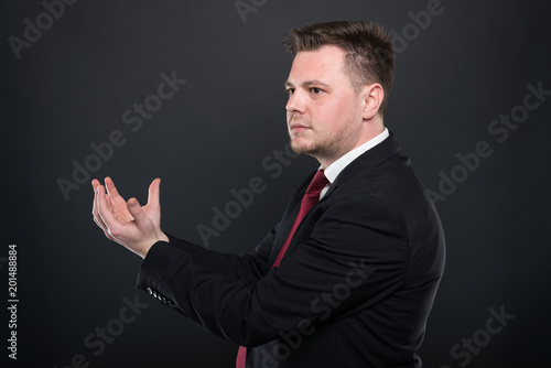 Business young man holding something in both hands.