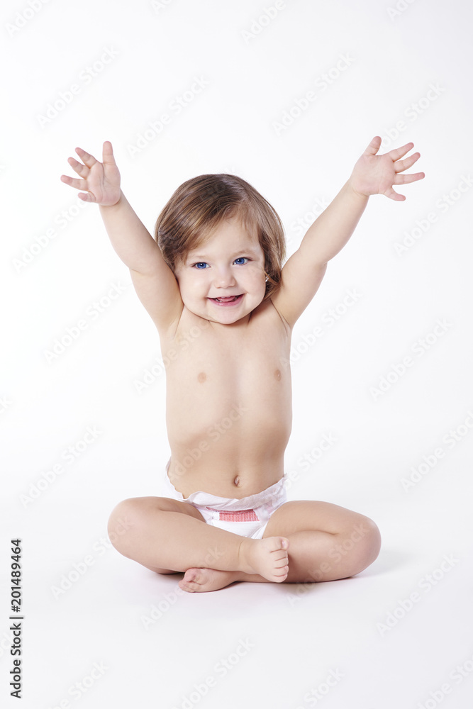 Child with hands up sitting at studio shot Child with hands up sitting at studio shot