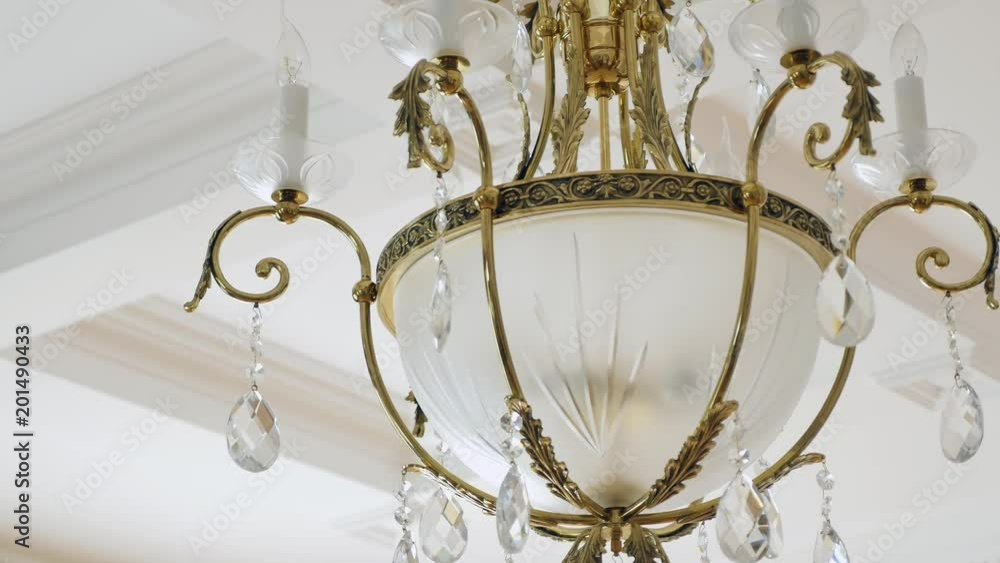elegant chandelier hanging under the ceiling elegant chandelier hanging under the ceiling