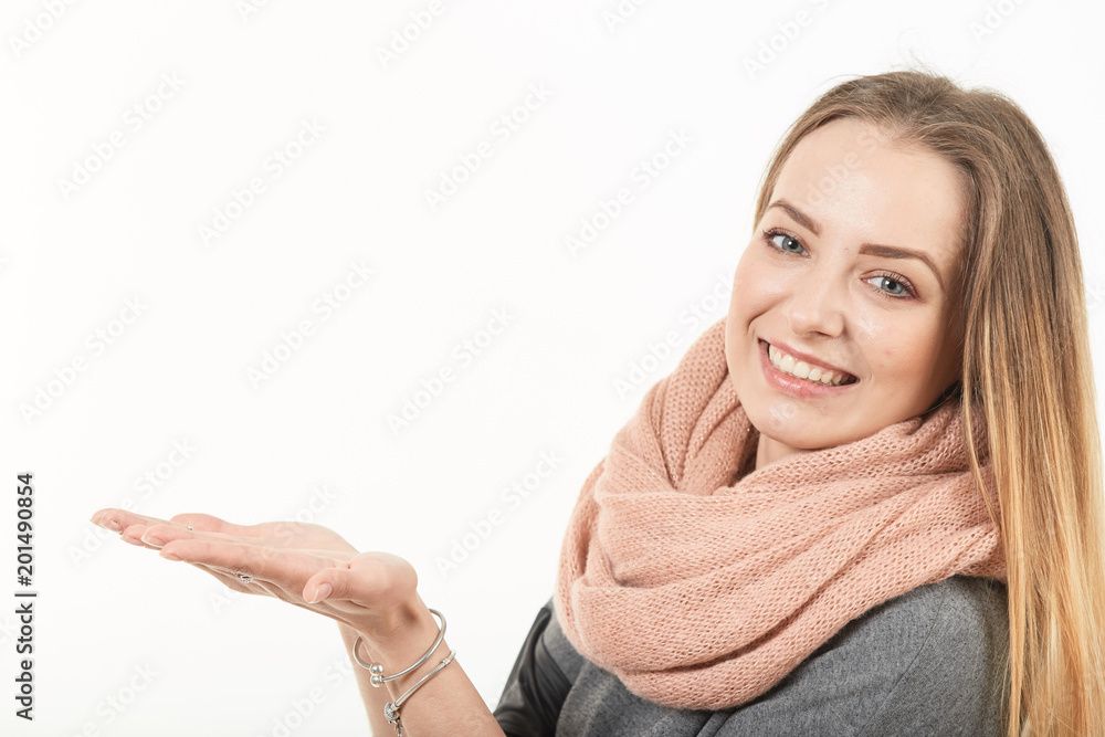 Portrait of a girl on a white background holds on her hand.
