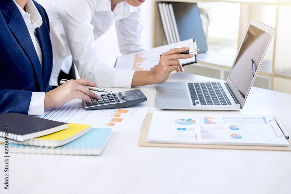 Teamwork of business colleagues consultation market growth on financial document graph report, professional occupation working analyzing startup and investment project to development grow to success Teamwork of business colleagues consultation market growth on financial document graph report, professional occupation working analyzing startup and investment project to development grow to success