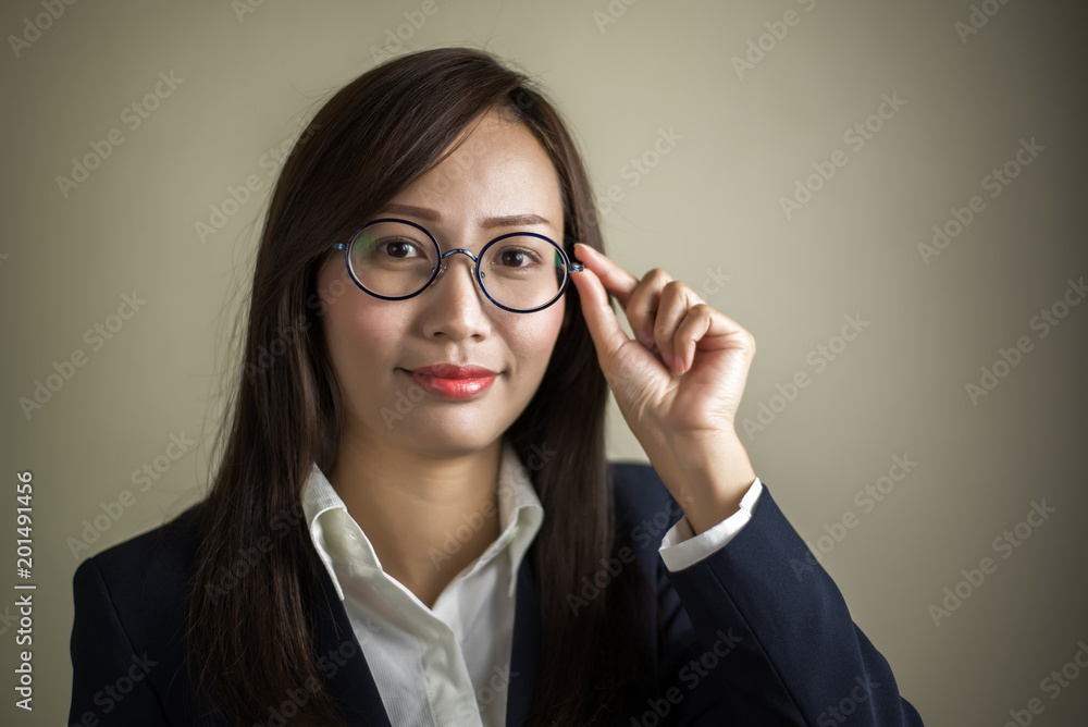 Portrait of young business woman in studio.