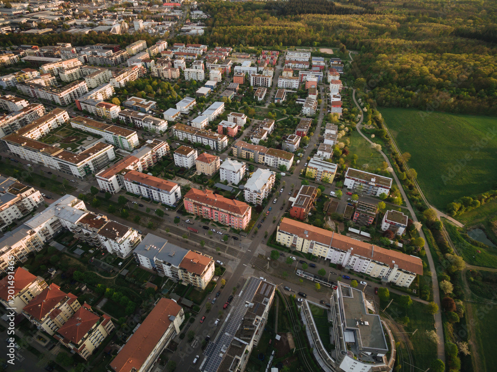 aerial view of streets of modern european town surrounded with trees, Kyiv, Ukraine