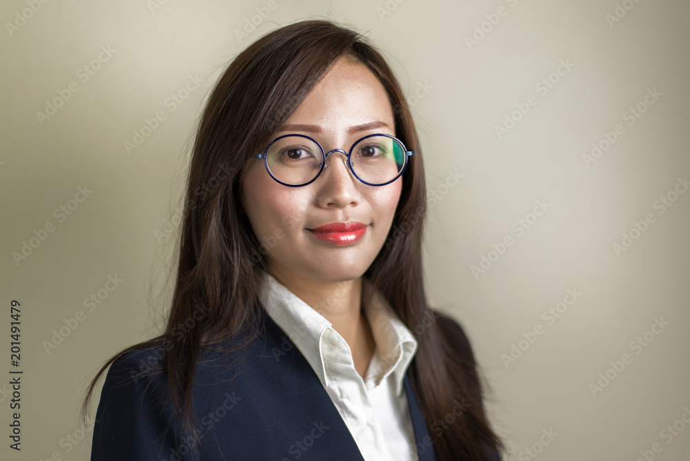 Portrait of young business woman in studio.