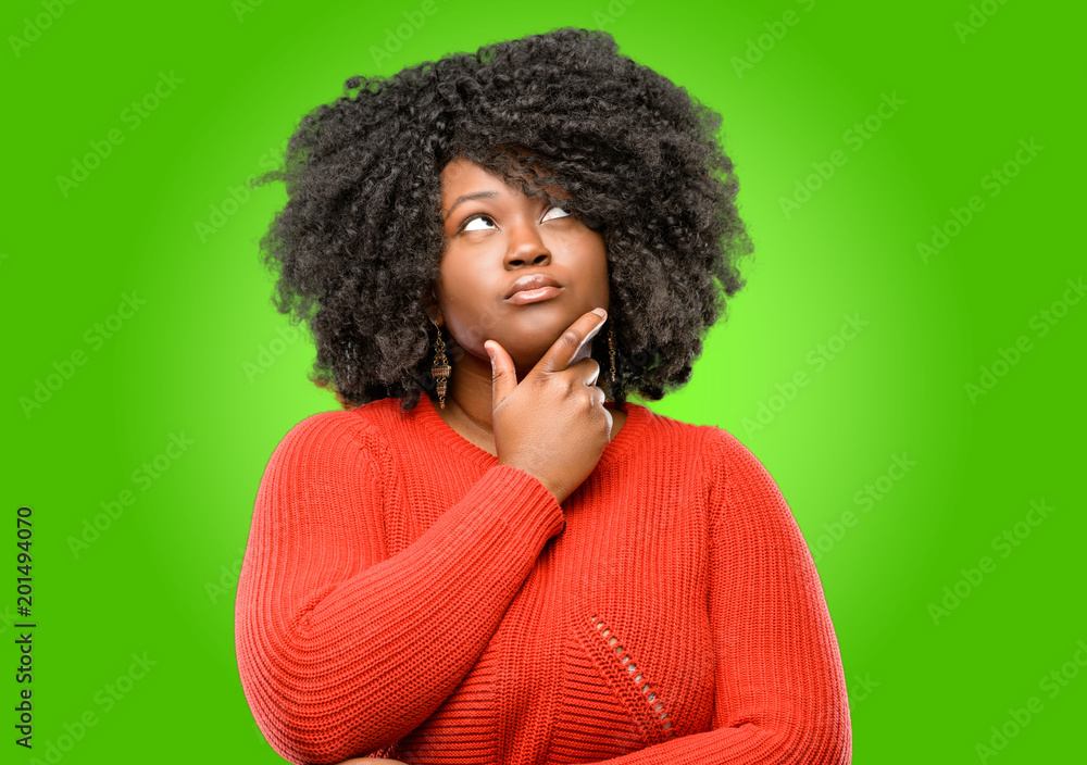 Beautiful african woman doubt expression, confuse and wonder concept, uncertain future Beautiful african woman doubt expression, confuse and wonder concept, uncertain future