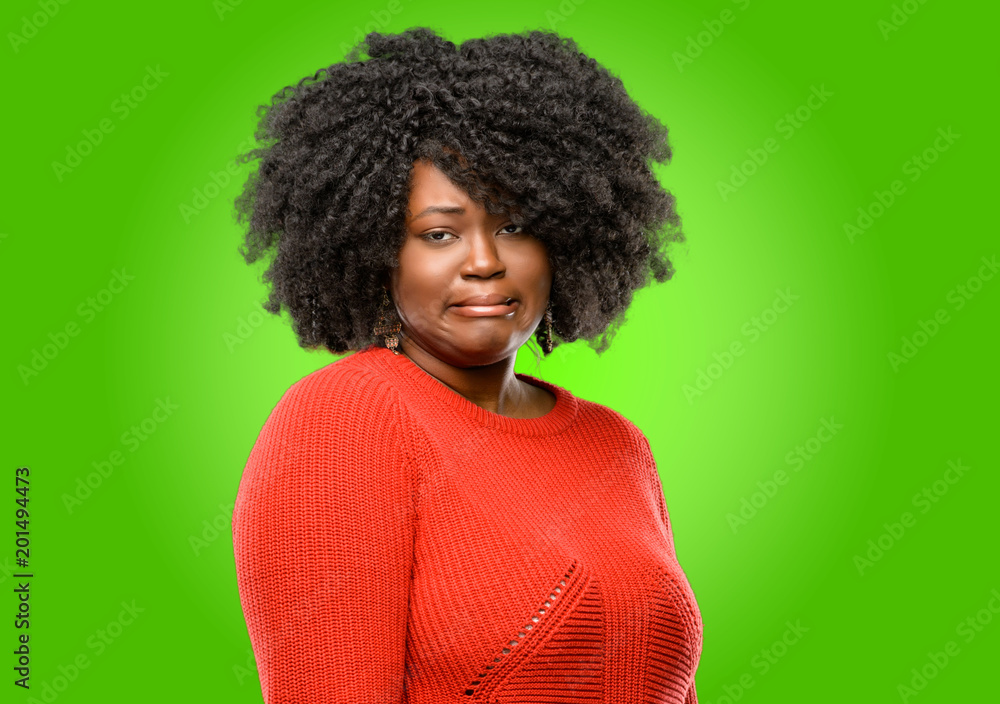 Beautiful african woman feeling disgusted with tongue out Beautiful african woman feeling disgusted with tongue out