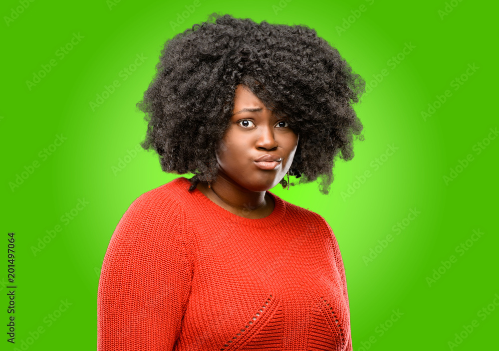 Beautiful african woman happy and surprised cheering expressing wow gesture Beautiful african woman happy and surprised cheering expressing wow gesture