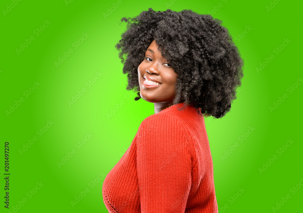 Beautiful african woman sticking out tongue at camera at sign of disobedience, protest and disrespect Beautiful african woman sticking out tongue at camera at sign of disobedience, protest and disrespect