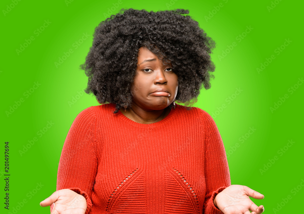 Beautiful african woman doubt expression, confuse and wonder concept, uncertain future Beautiful african woman doubt expression, confuse and wonder concept, uncertain future