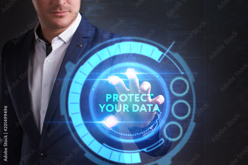 Business, Technology, Internet and network concept. Young businessman working on a virtual screen of the future and sees the inscription: Protect your data Business, Technology, Internet and network concept. Young businessman working on a virtual screen of the future and sees the inscription: Protect your data
