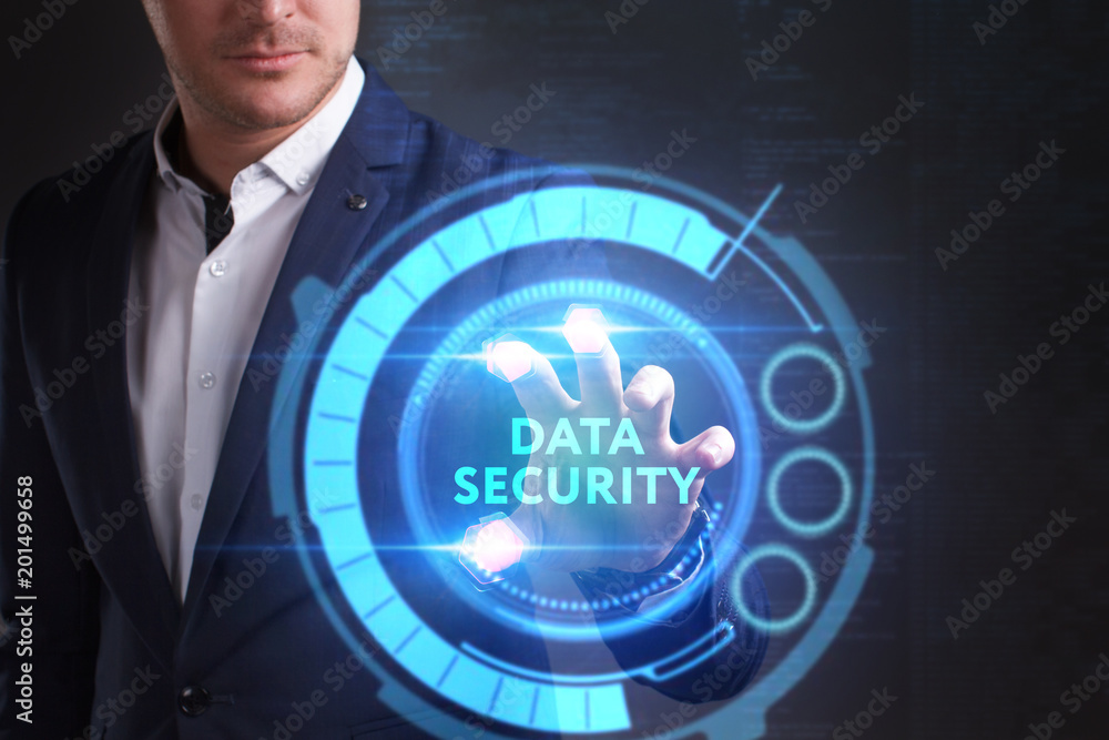 Business, Technology, Internet and network concept. Young businessman working on a virtual screen of the future and sees the inscription: Data security Business, Technology, Internet and network concept. Young businessman working on a virtual screen of the future and sees the inscription: Data security