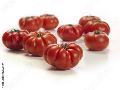 Marmande tomatoes on white table