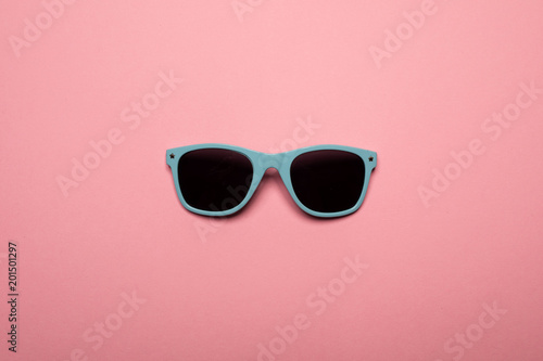 Cool sunglasses on pink background