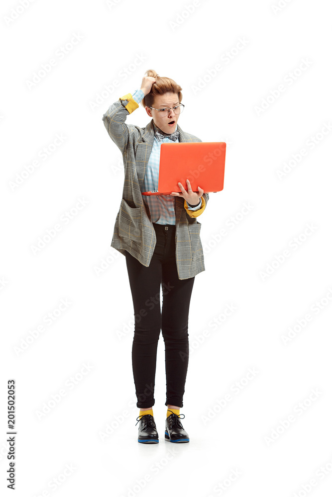 Full length portrait of a happy smiling female student holding notebook isolated on white background Full length portrait of a happy smiling female student holding notebook isolated on white background