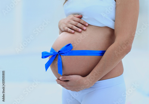 Wallpaper Mural Happy pregnant woman measuring her tummy and waist. Torontodigital.ca