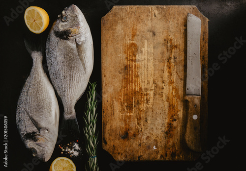 Two fish and cutting board