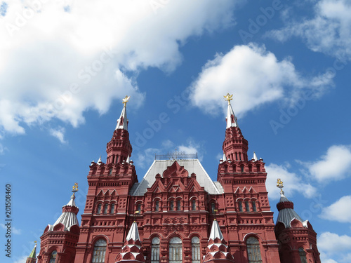 Red square in Moscow, russian landmark. Building of the state historical Museum on the background of cloudy blue sky