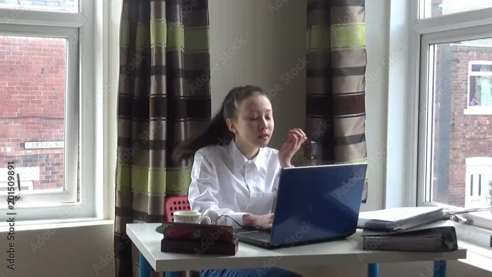 A young woman working in an office and getting tired A young woman working in an office and getting tired