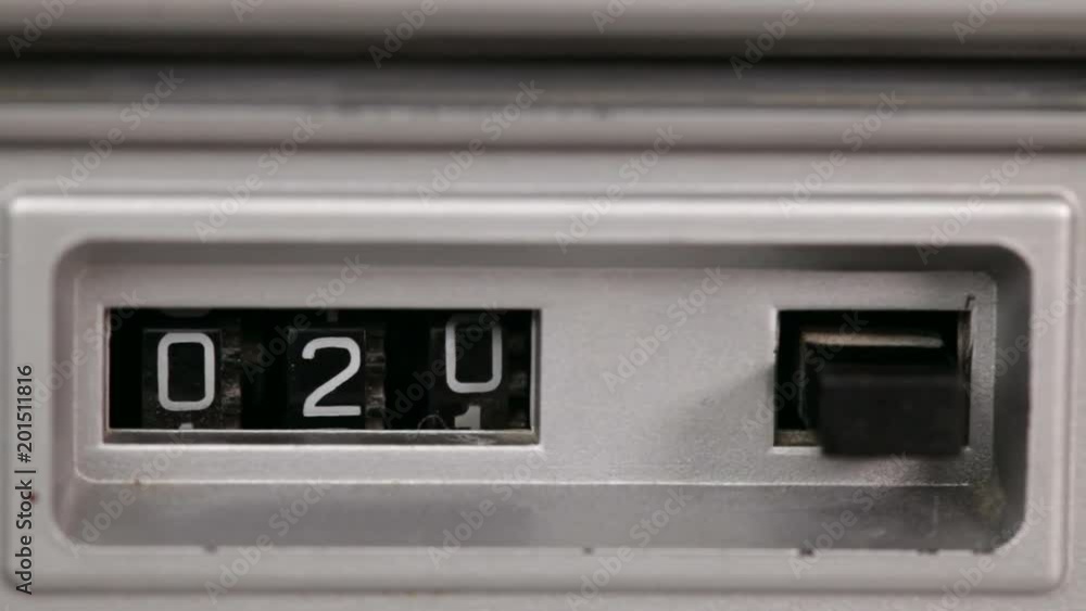 Retro mechanical counter with reset button counting down to zero, static camera, closeup Retro mechanical counter with reset button counting down to zero, static camera, closeup
