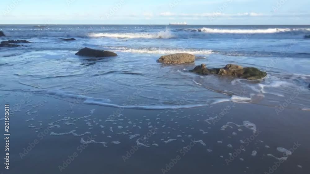 A stunning sea with a few rocks and sand, Newcastle upon Tyne, United Kingdom A stunning sea with a few rocks and sand, Newcastle upon Tyne, United Kingdom
