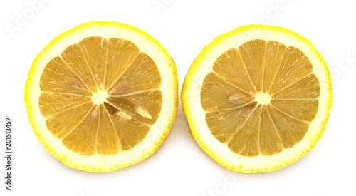 fresh organic heap of cut yellow lemon isolated on white background, slices, the taste is sour, from the garden, cooking, good health, can make smoothie in summer with front view