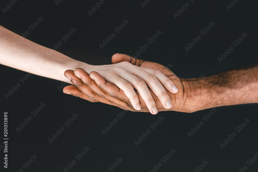 cropped image of african american boyfriend and girlfriend holding hands isolated on black