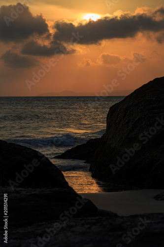 fishing boat to the sea at sunset