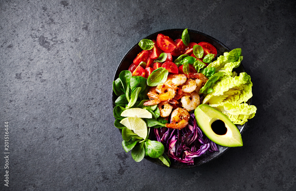 Colorful Poke Bowl with Roasted Sesame Prawns, Red Cabbage, Avocado, Cherry Tomatoes, Corn Salad and Lettuce