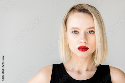 beautiful stylish blonde woman with red lips isolated on white