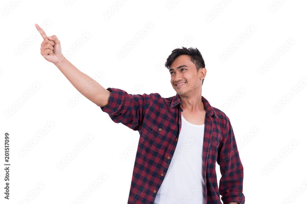 Asian handsome guy is pointing at something. On a white background Asian handsome guy is pointing at something. On a white background