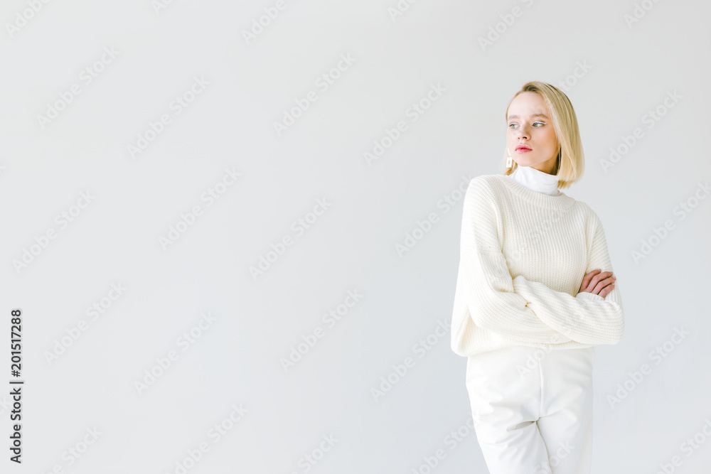beautiful stylish blonde woman in white clothes standing with crossed arms isolated on white beautiful stylish blonde woman in white clothes standing with crossed arms isolated on white